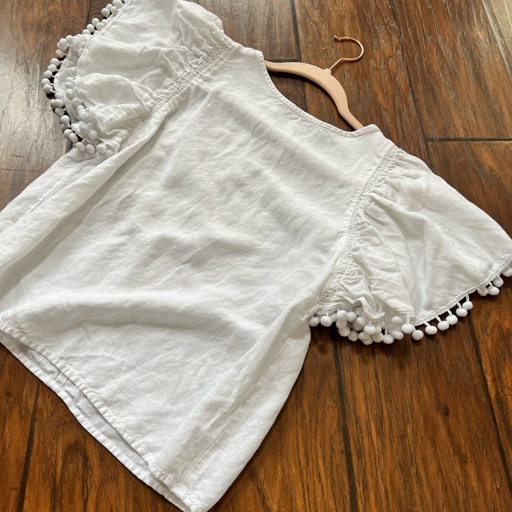 White pompom sleeve blouse